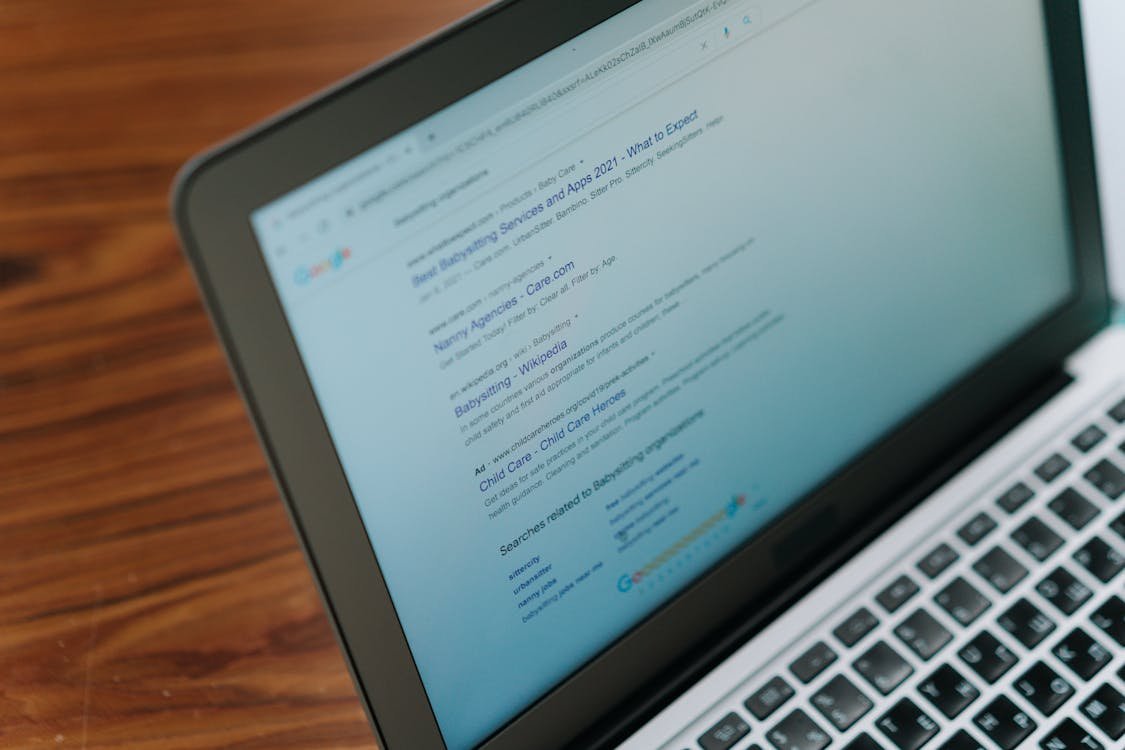 Laptop showing Google search results used for competitor research