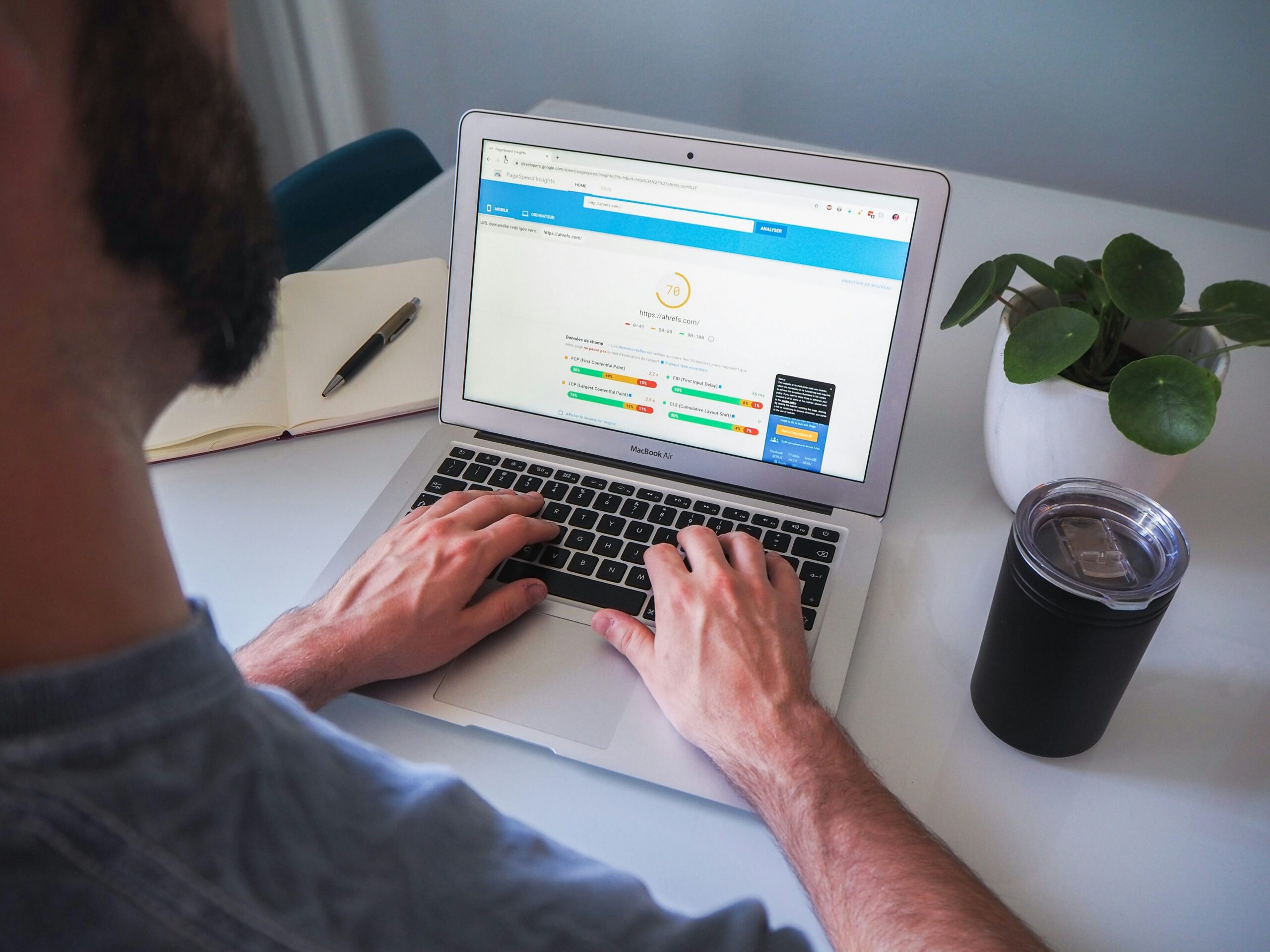 Person working on a laptop showing a website test, illustrating conversion rate optimisation